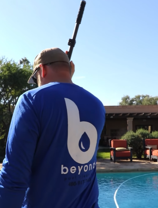 Beyond Pool Cleaning technician servicing a Scottsdale residential pool