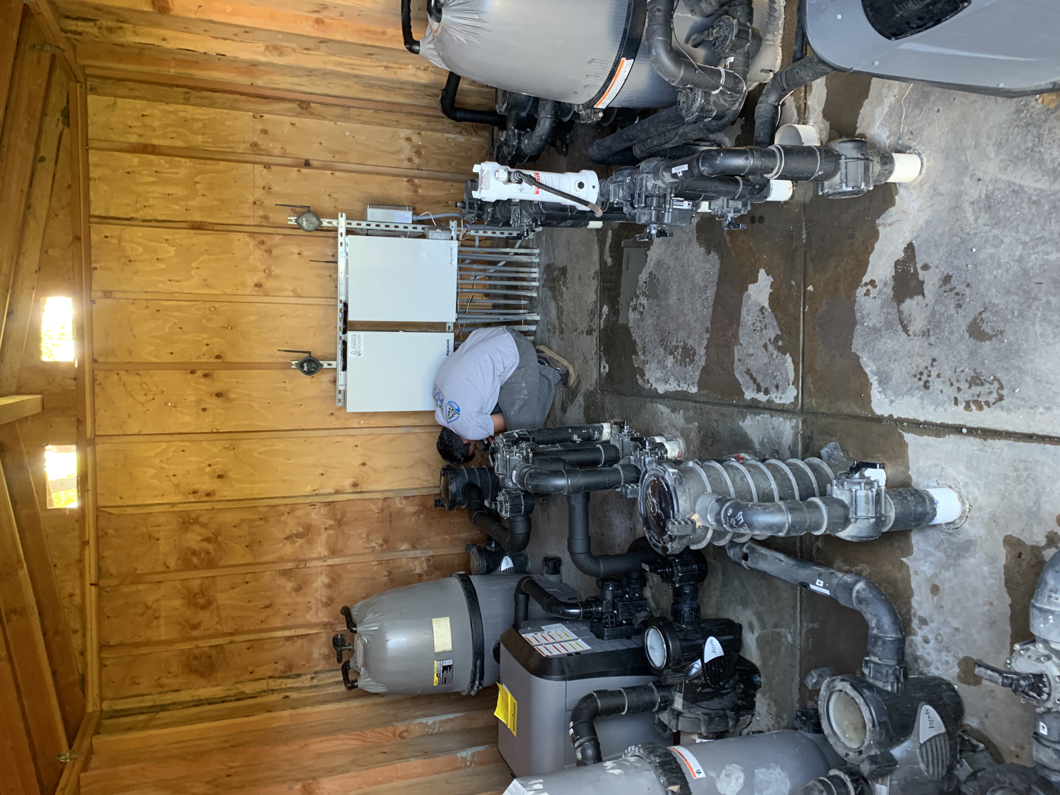 Beyond Pool Cleaning technician servicing pool equipment at a Scottsdale property